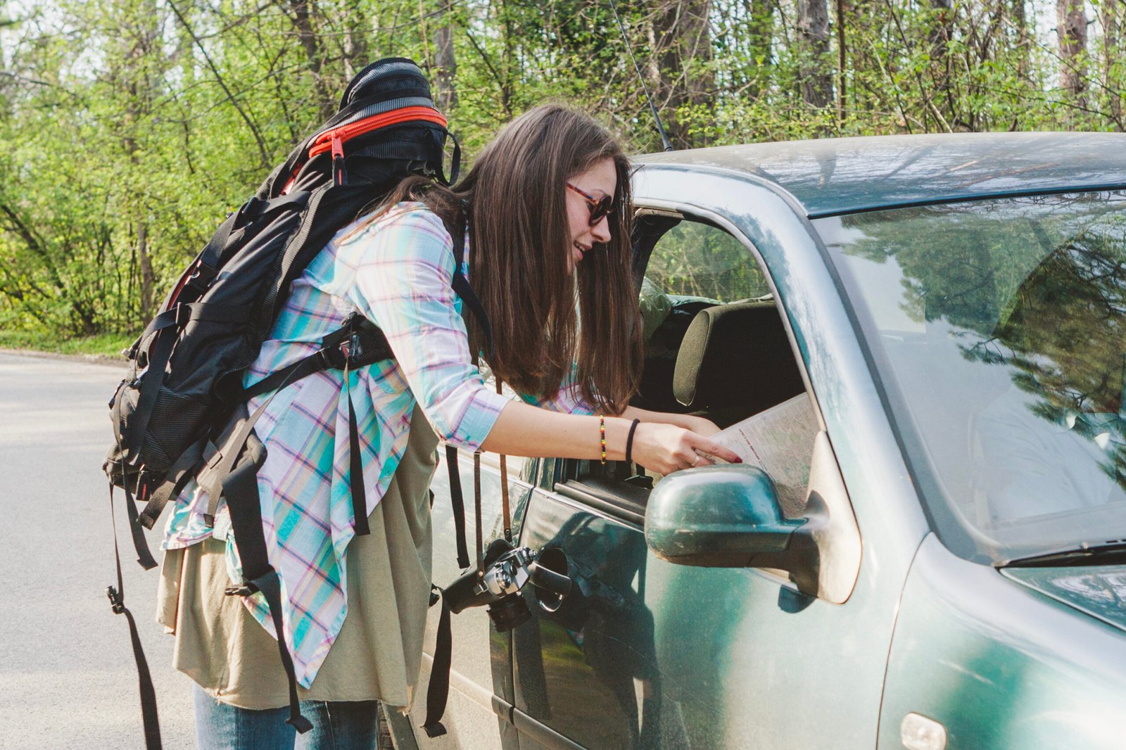 girl with backpack talking driver scaled