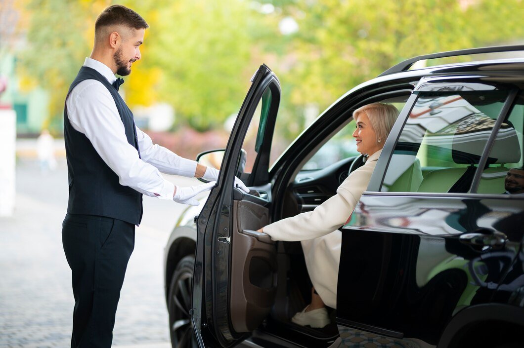 parking valet helping woman park her car 23 2149946634